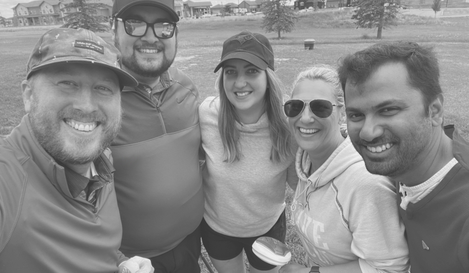 A group selfie on a golf course